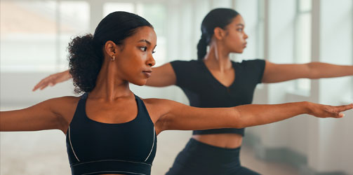 Women stretching shoulders Women stretching shoulders