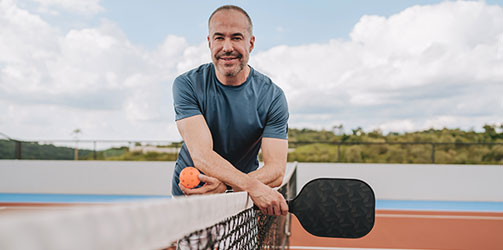 Man on pickleball court Man on pickleball court
