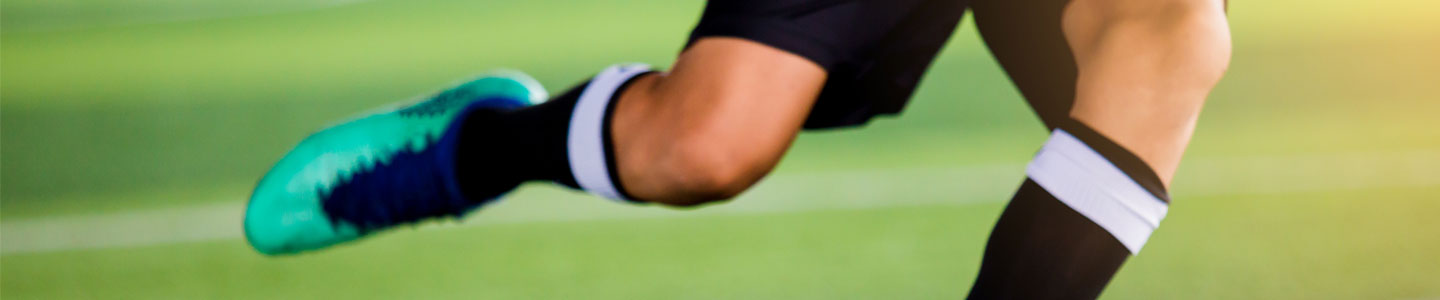 Soccer player kicking ball