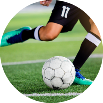 Soccer player kicking ball